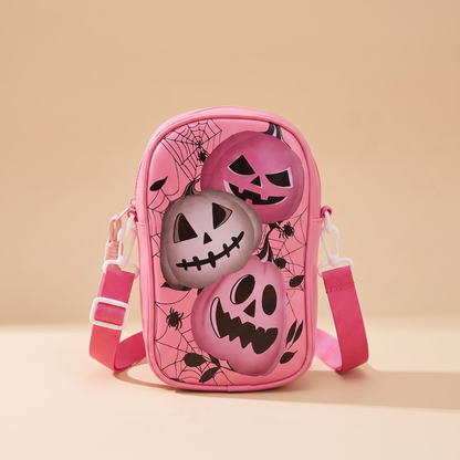 Boo Bags Pink Pumpkin Trio crossbody phone bag, hot pink with three jack-o-lanterns on a cobweb